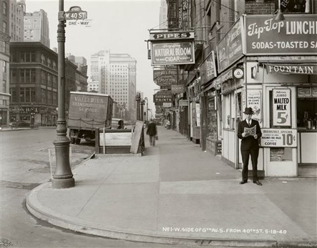 May 18th, 1940â6th Avenue and 40th Street. Caption on photo reads: âNazi Army Now 75 Miles From Paris."